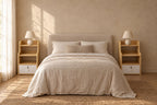 Pair of oak-effect bedside tables with open shelves and a lockable drawer on each side of a double bed