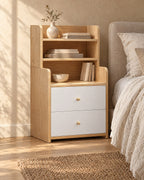 Three-quarter view of the oak and white bedside table with hutch shelves