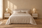 Pair of oak and white bedside tables on each side of a double bed