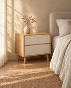 Three-quarter view of the oak and white bedside table showing the splayed wooden legs