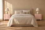 Pair of pink bedside tables on each side of a double bed