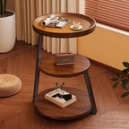 Front view of the round three-tier walnut-tone bedside table with black metal legs