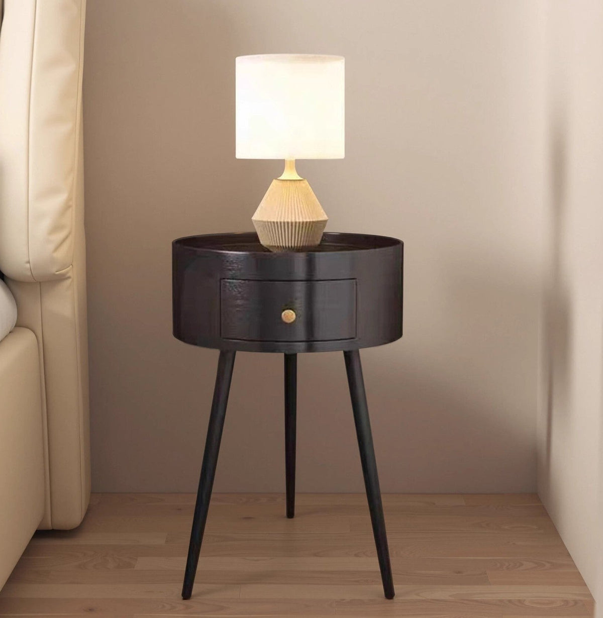 Round black bedside table with drawer, supplier product photo