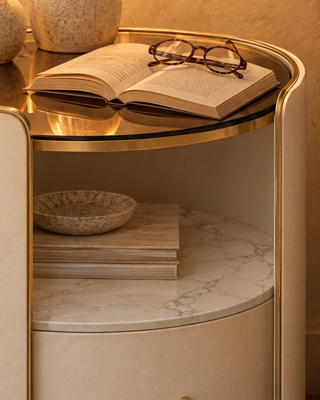 Close-up of the tinted glass top, gold trim and marble-effect shelf