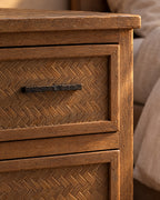 Close-up of the herringbone-textured drawer panel and slim black bar handle