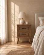 Rustic wood bedside table with herringbone drawers in warm morning light