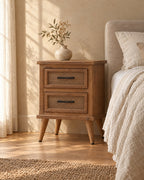 Three-quarter view of the rustic wood bedside table with herringbone drawers
