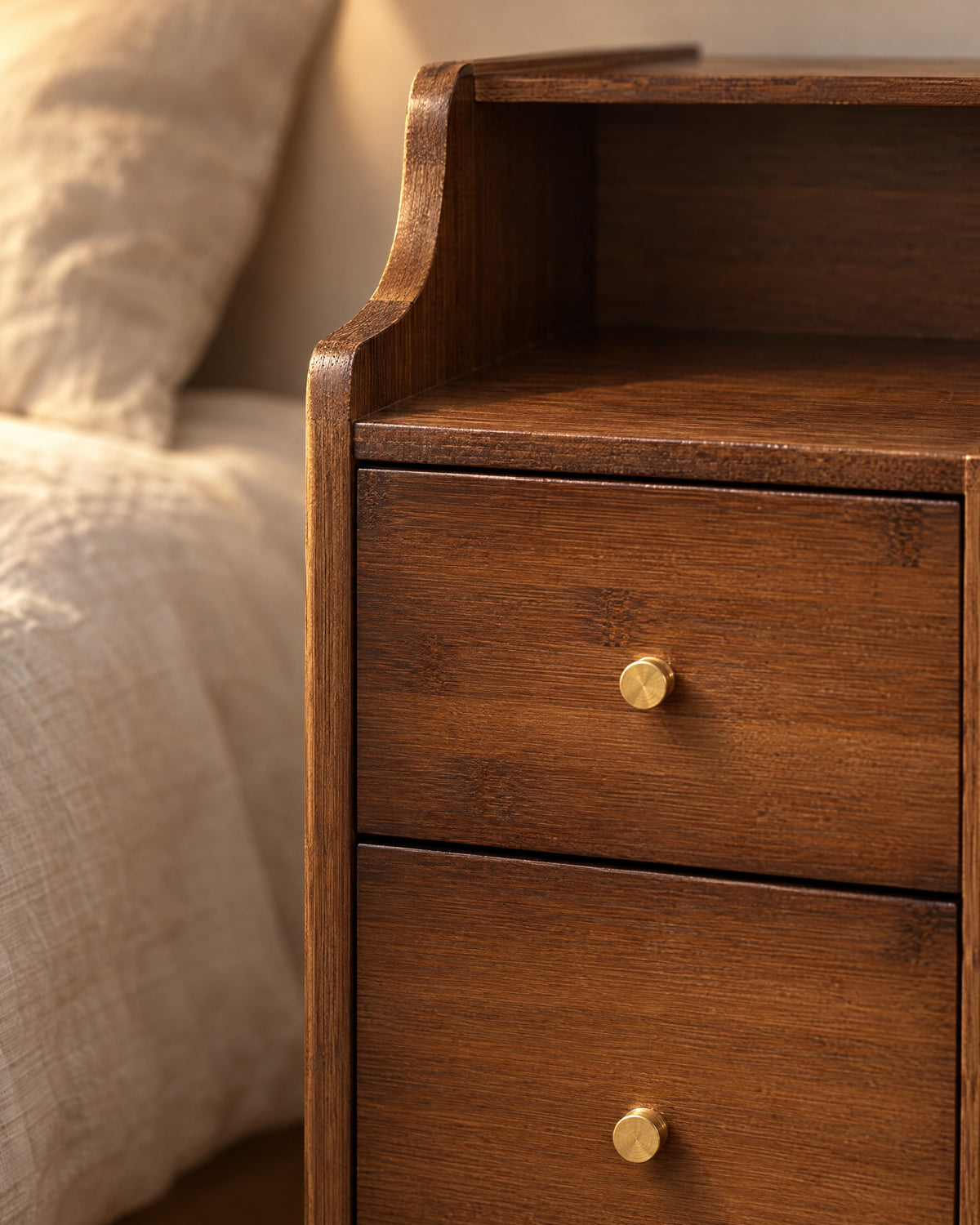 Close-up detail of the slim walnut-finish bamboo bedside table