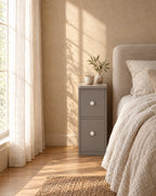 Slim grey bedside table in warm morning light