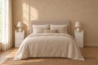 Pair of slim white bedside tables on each side of a double bed