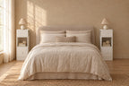 Pair of slim white bedside tables on each side of a double bed