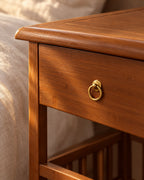 Close-up of the brass ring pull on the bamboo drawer