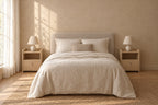 Two small light wood bedside tables with a lockable drawer and an open shelf on each side of a double bed