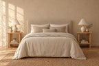 Pair of small oak-effect bedside tables on each side of a double bed