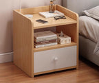 Small oak and white bedside table in a bedroom