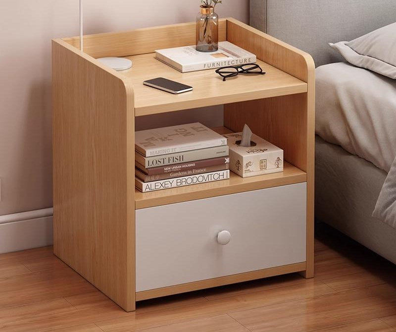 Small oak and white bedside table in a bedroom