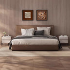 Two tan and ivory bedside tables beside a bed