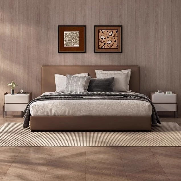 Two tan and ivory bedside tables beside a bed