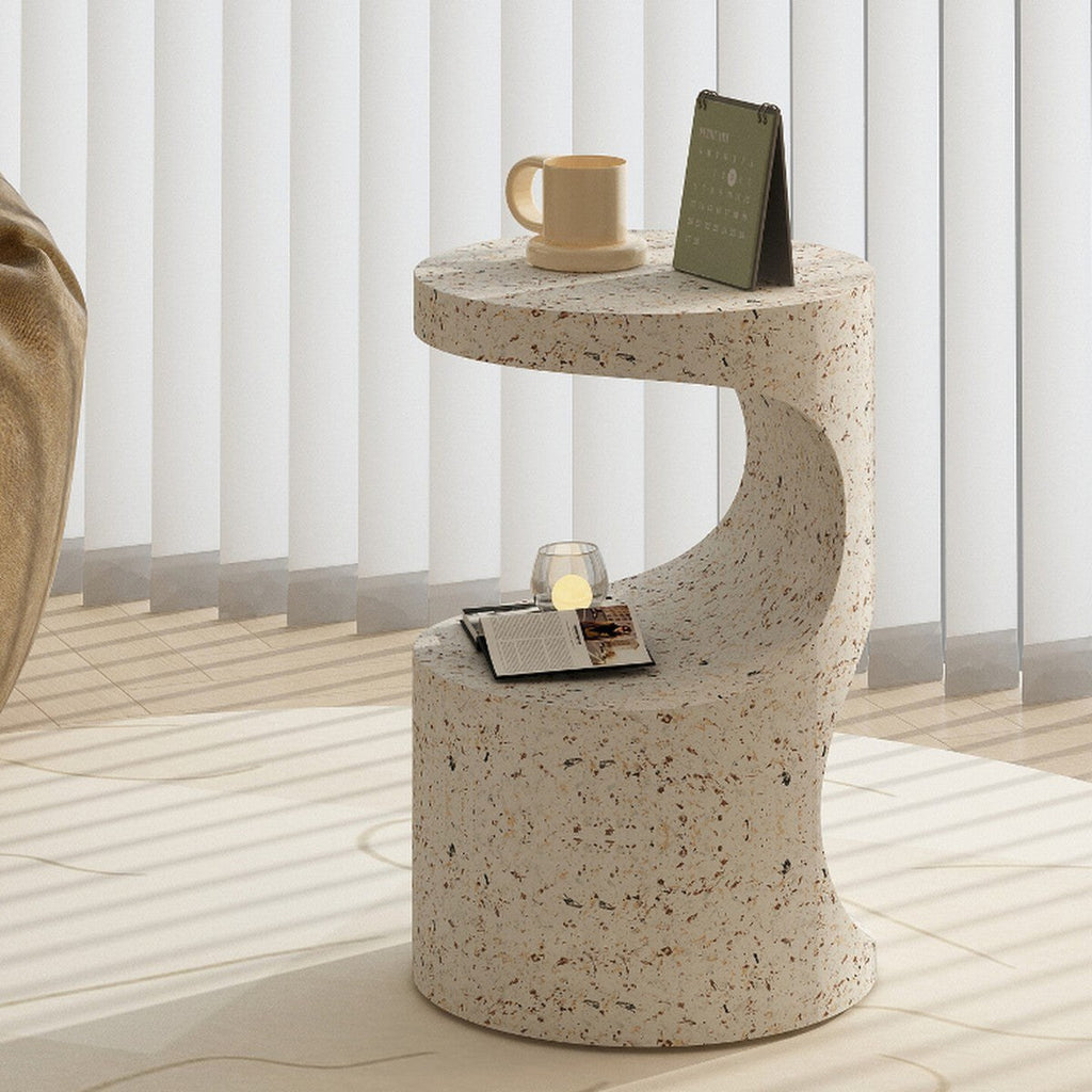 Terrazzo-look round sculpted bedside table in a bedroom
