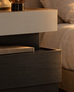 Close-up of the open tray between the greige top box and the black base