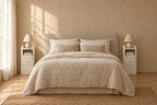 Pair of ultra-narrow white bedside tables on each side of a double bed