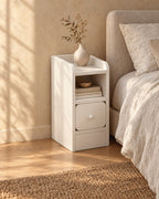 Three-quarter view of the ultra-narrow white bedside table