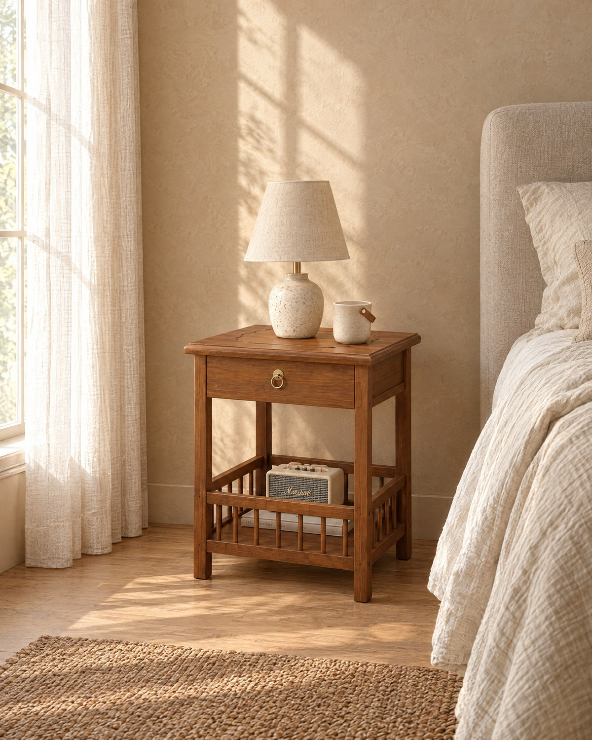 Walnut bamboo bedside table with a spindle gallery shelf in morning light