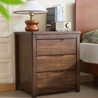 Front view of the walnut bedside table with three drawers and carved finger pulls
