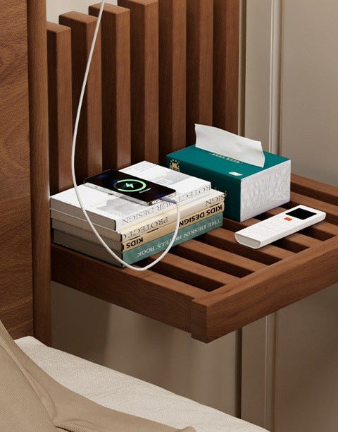Walnut fold-down wall bedside shelf in a bedroom