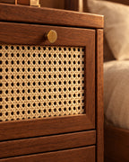 Close-up of the woven cane drawer front and brass knob
