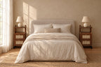Pair of walnut rattan bedside tables on each side of a double bed