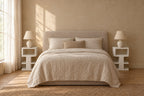 Pair of white open-tier bedside tables on each side of a double bed