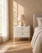 White bedside table with two drawers in morning light