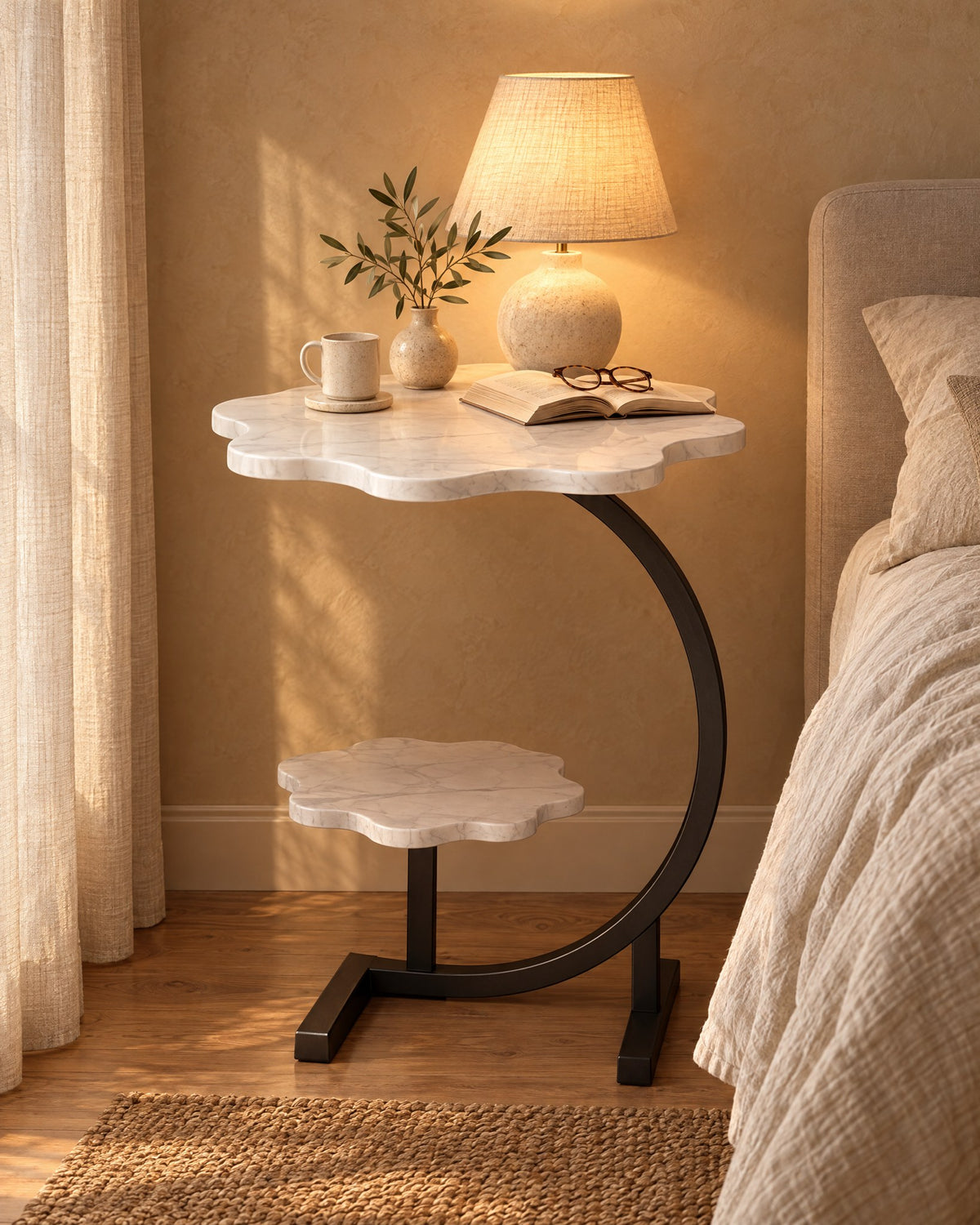 White Cloud Bedside Table with a lamp switched on and an open book in the evening