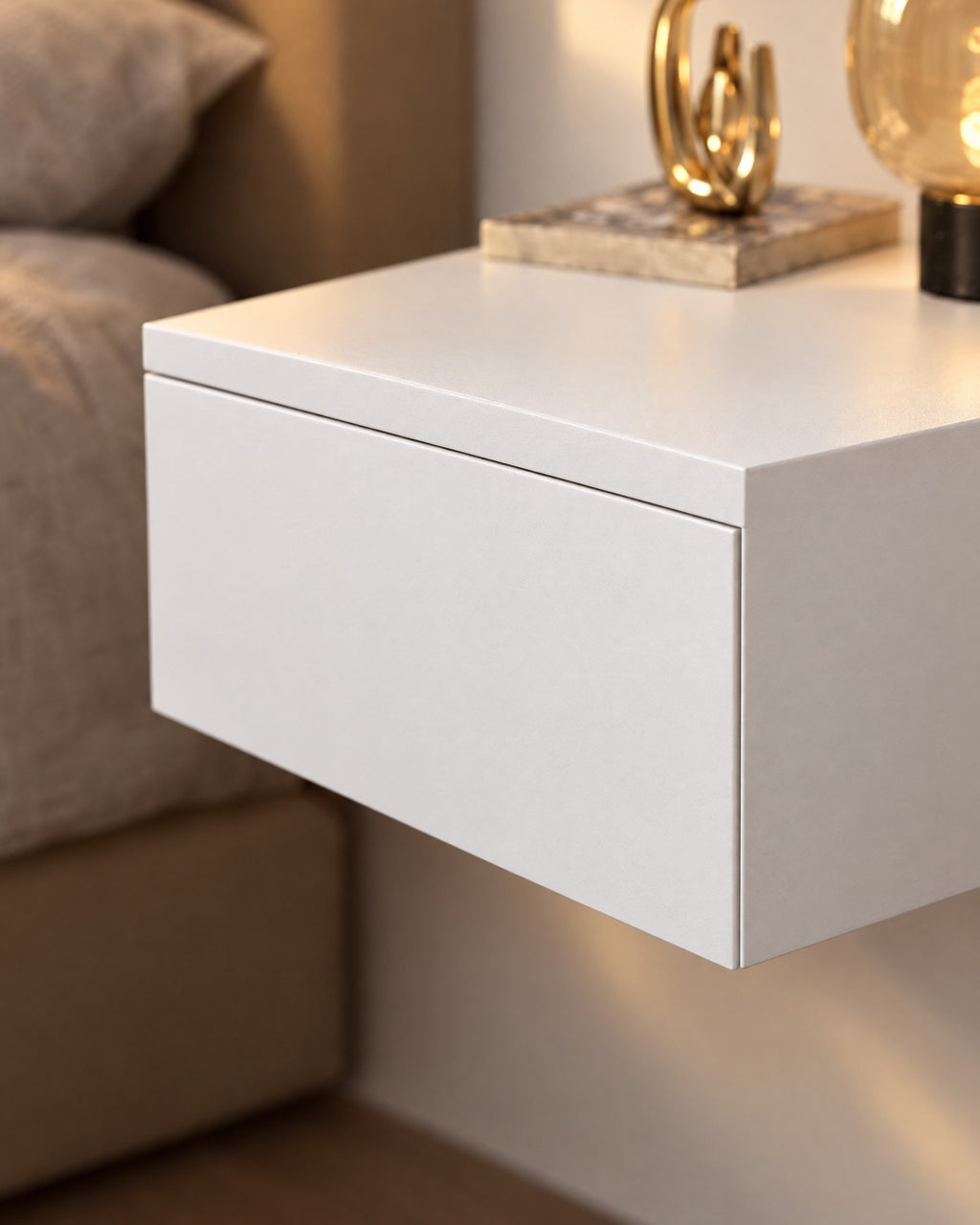 Close-up detail of the white floating bedside table