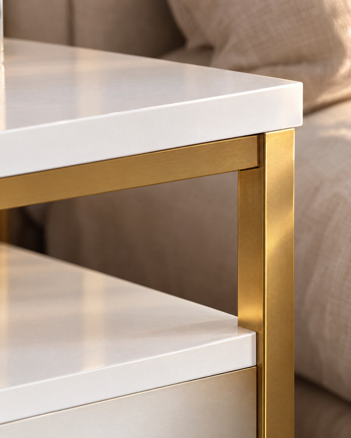 Close-up of the white top resting on the slim gold frame