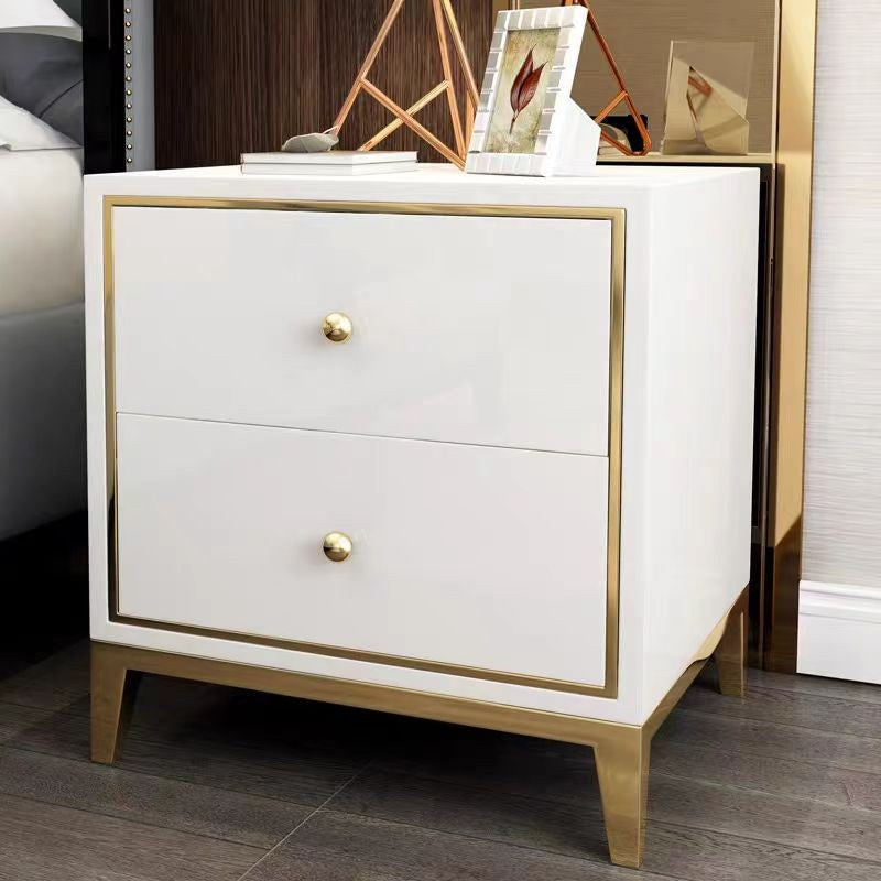 White and gold bedside table in a living space