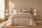Pair of white round bedside tables on each side of a double bed